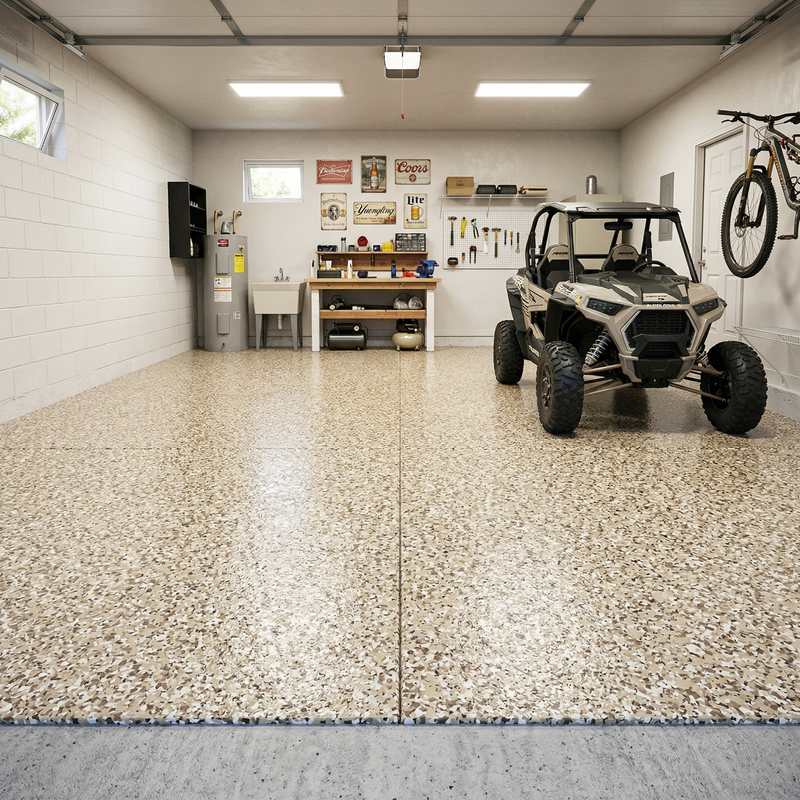 Garage with a Polaris RZR vehicle, workbench, and tools on a speckled concrete epoxy floor.