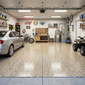 Garage with epoxy floor and a car, motorcycle, and various tools.