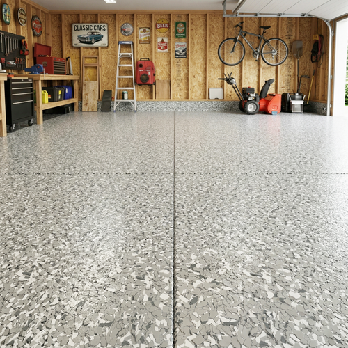 Garage with a textured concrete epoxy floor, tools, and equipment on wooden walls.