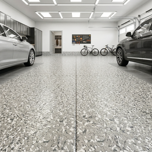 Garage epoxy floor interior with two cars, bicycles, and a wall art piece.